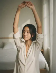Woman doing a gentle 10-minute morning stretch by her bed